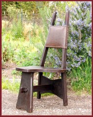 Charles Limbert quartered oak Hall or Cafe chair, wood seat, Spanish leather back.